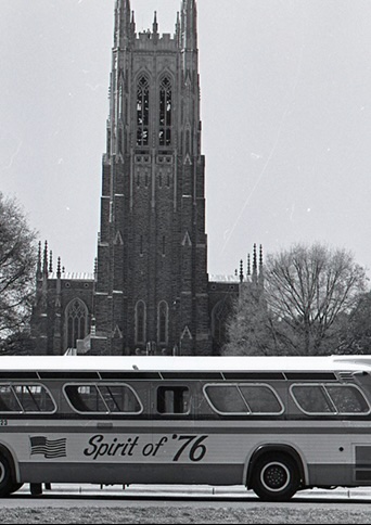 A historical photo of the Spirit of '76 bus parked in front of Duke Chapel