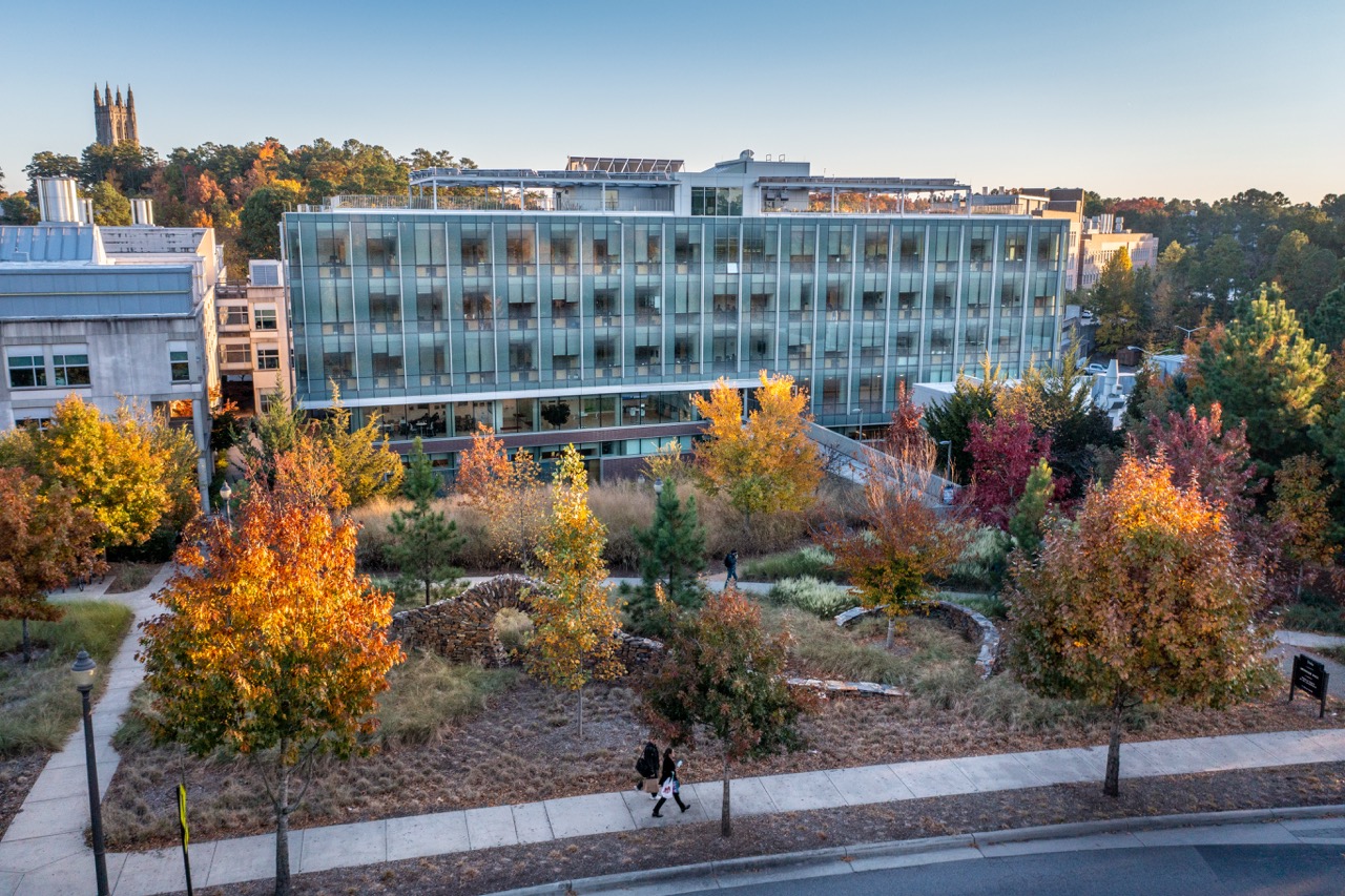 Fall aerial of Environmental Hall, home of the Nicholas School for the Environment, looking back towards Duke Chapel